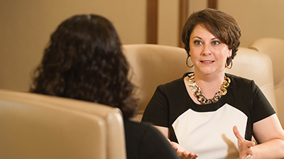 Columbia Insurance Group Two women in business attire having a meeting